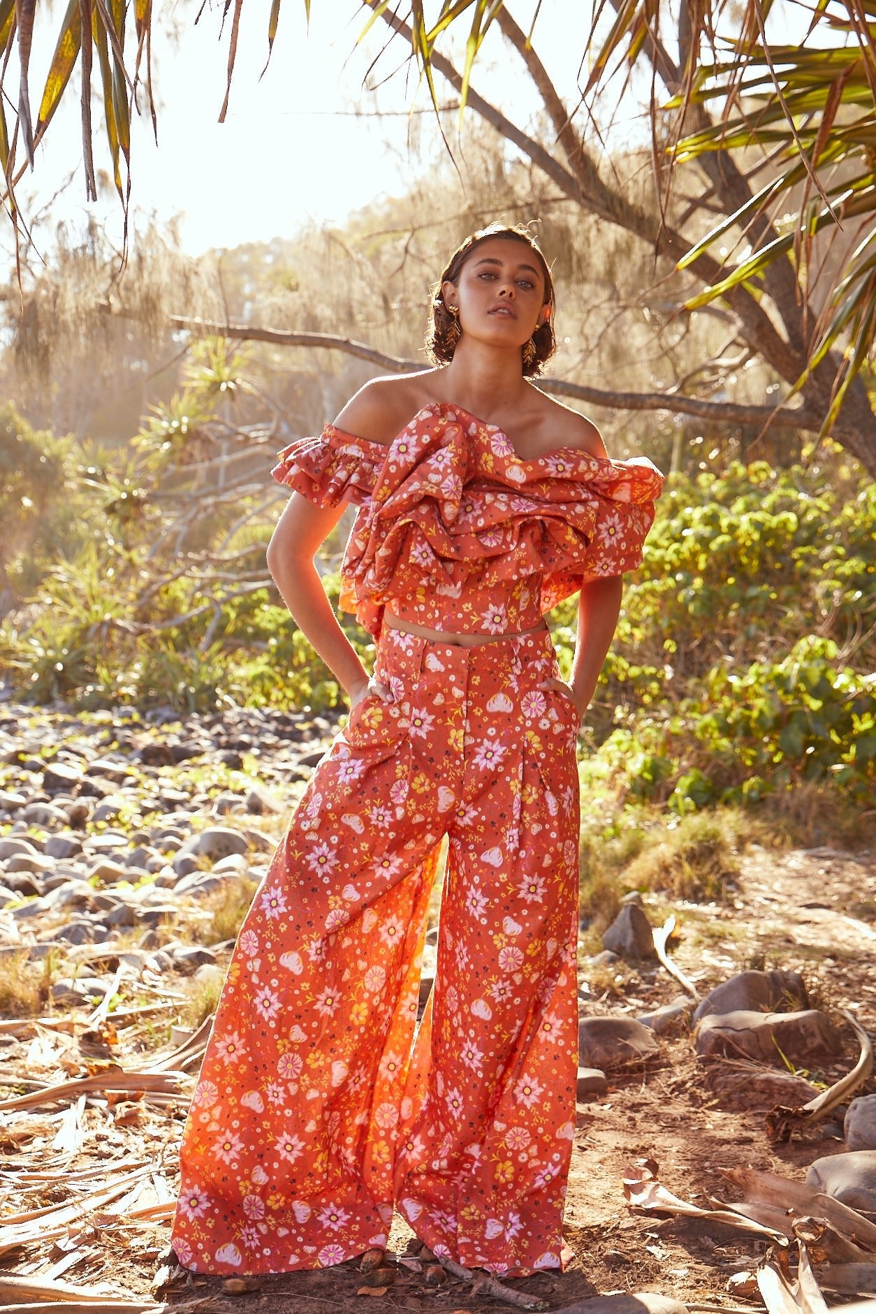 High-waisted linen trousers in Bloom Print by Mabel Brempong, tailored in Italian linen and cotton blend with deep front pleats for added volume and movement. Inspired by the wildflowers of South Africa's Namaqualand Desert, this original print captures timeless elegance in a captivating silhouette.